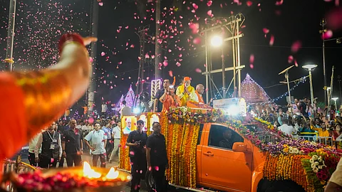 Prime Minister Narendra Modi with Uttar Pradesh Chief Minister Yogi Adityanath during a roadshow for Lok Sabha elections, in Ayodhya, Sunday.