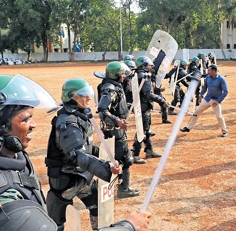 Kakinada district police take part in a mock drill on Friday