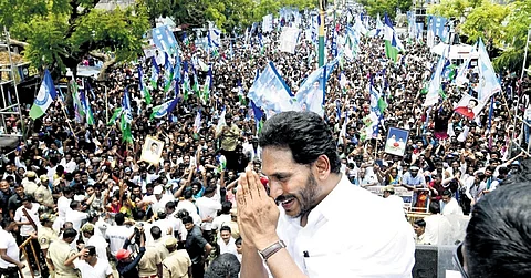 Chief Minister YS Jagan Mohan Reddy greeting the public during an election rally at Repalle in Bapatla district on Monday 