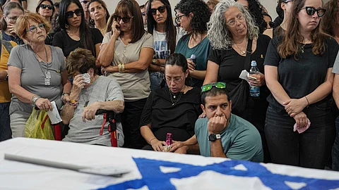 Mourners attend the funeral of Michel Nisenbaum, who was killed during Hamas' Oct. 7 attack and whose body was taken into Gaza, in Ashkelon, Israel,