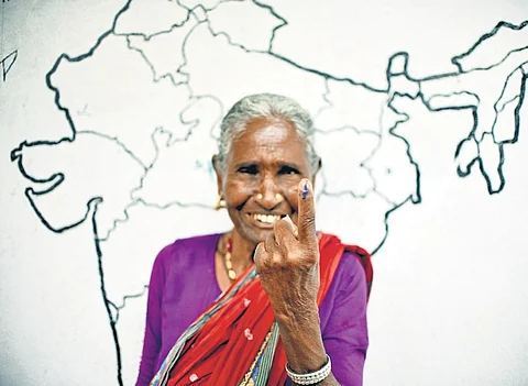 An elderly woman is ecstatic to show her inked finger after casting her vote at Loyapally in Bhongir Lok Sabha seat on Monday
