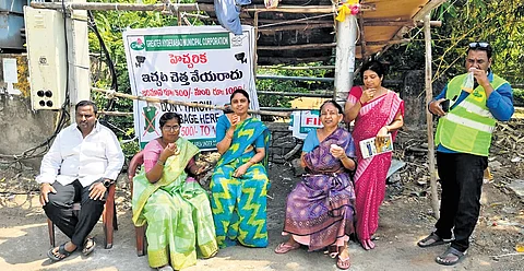 Self Help Group (SHG) volunteers serve tea to people at a GVP in Kukatpally