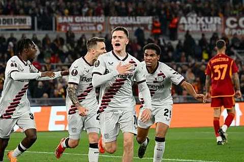 Bayer Leverkusen's German midfielder Florian Wirtz celebrates after scoring his team first goal during the UEFA Europa League semi-final