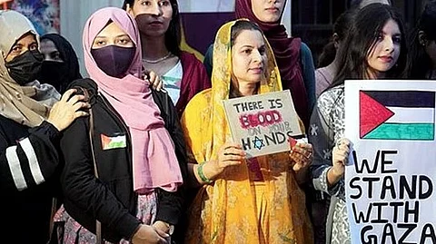 Activists during a demonstration to show solidarity with Palestine, in Bengaluru.