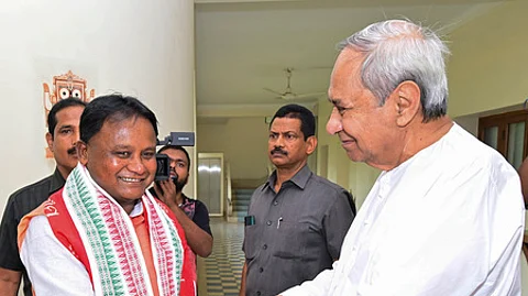 Mohan Charan Majhi and Naveen Patnaik (Right)