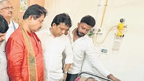 LoP R Ashoka meets a stabbing victim at a Mangaluru hospital on Wednesday