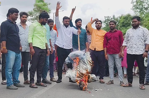 ABVP activists burn an effigy representing the National Testing Agency during a protest at the Osmania University.