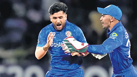 Fazalhaq Farooqi and Rahmanullah Gurbaz (L) have been standout performers for Afghanistan
