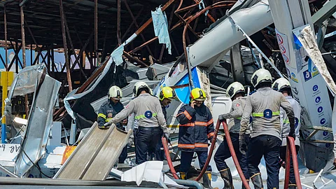 Fire brigade personnel at the site of the hoarding collapse at Ghatkopar, in Mumbai