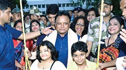 CM Mohan Charan Majhi with children during a Raja event in Bhubaneswar
