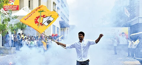 TDP activists burst crackers in joy at Mangalagiri party office
