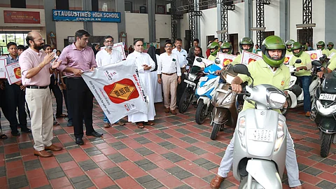 Ernakulam District Collector N S K Umesh flagging off the two-wheeler rally at St Augustine’s High School at Kaloor in Kochi as part of TNIE’s road safety campaign