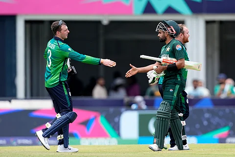 Ireland's Lorcan Tucker, left, congratulates Pakistan's captain Babar Azam after Pakistan won the ICC Men's T20 World Cup cricket match against Ireland on June 16, 2024.