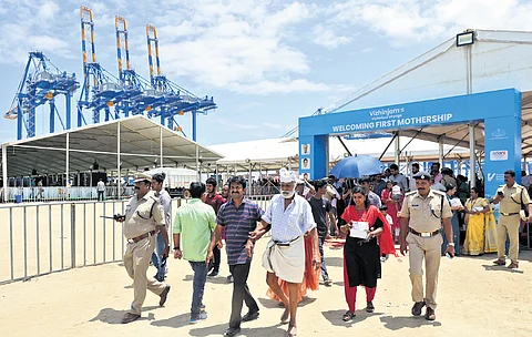People exit the venue after the official inauguration ceremony of the trial operations of Vizhinjam International Seaport in Thiruvananthapuram on Friday