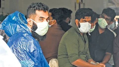 Younis waits at the Meppadi health centre on Friday for news about his parents, who went missing in the twin landslides in Wayanad. Younis has lost 11 relatives in the disaster. He received the mortal remains of his sister and niece earlier.