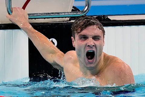 United States' Bobby Finke celebrates winning the gold medal in the men's 1500-meter freestyle final at the Summer Olympics in Nanterre, France, Sunday, Aug. 4, 2024.