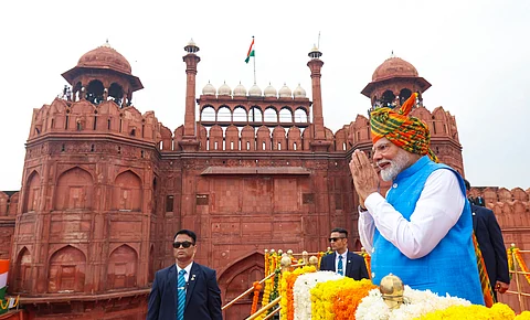 Prime Minister Narendra Modi greets the gathering at the Red Fort on 78th Independence Day