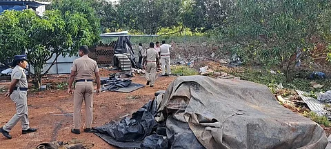 Police personnel inspecting the spot where the explosion took place in Dindigul on Sunday morning.