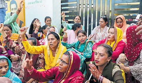 BJP workers protest after the release of first list of candidates.