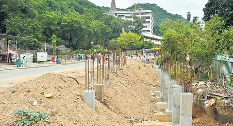 Elevated queue line works come to a halt at Durga temple.