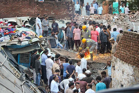 Rescue operation underway after a house collapsed, in Meerut, Saturday, Sept. 14, 2024.