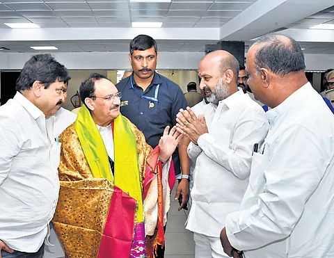 BJP national president and Union Minister JP Nadda interacts with state party leaders after reviewing the party’s membership drive, in Hyderabad on Saturday