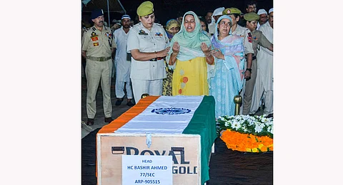 Family members during the wreath laying ceremony of J&K head constable Bashir Ahmed who was killed in in Kathua encounter, in Jammu, Sunday, Sept. 29, 2024.