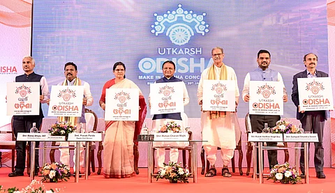 Chief Minister Mohan Charan Majhi releasing the logo of Utkarsh Odisha: Make-in-Odisha Conclave 2025