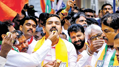 State BJP president BY Vijayendra and other senior party leaders celebrate the party’s performance in the Haryana and Jammu and Kashmir Assembly elections, at the party office in Bengaluru on Tuesday