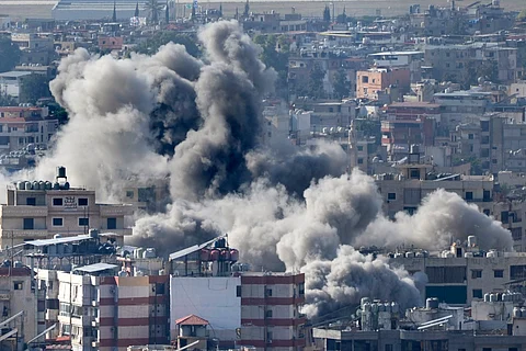 Smoke rises between buildings hit in an Israeli airstrike in Dahiyeh, in the southern suburb of Beirut, Lebanon