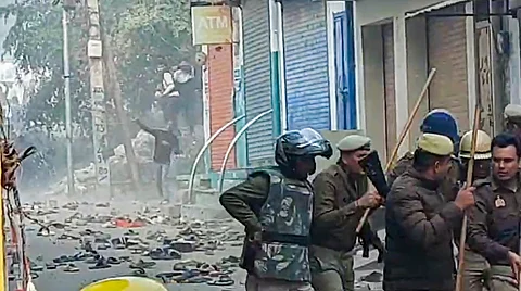 Locals pelt stones at security personnel during a second survey of the Jama Masjid, claimed to be originally the site of an ancient Hindu temple, in Sambhal.