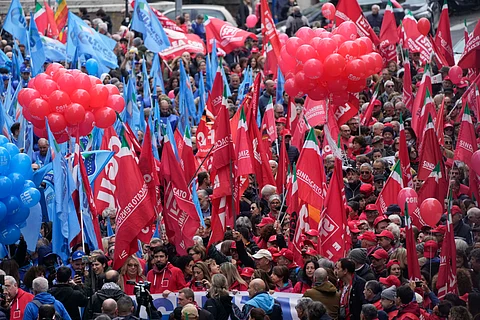 Demonstrators gather during a public and private sectors' national strike called by the labor unions to protest against government's budget law in Rome, Friday, Nov. 29, 2024.