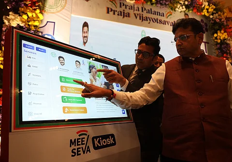 IT & Industries Minister D Sridhar Babu inaugurates the MeeSeva kiosk during the Praja Palana Vijayotsavalu programme