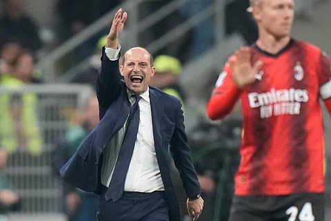 Coach Massimiliano Allegri gestures during a Serie A soccer match.