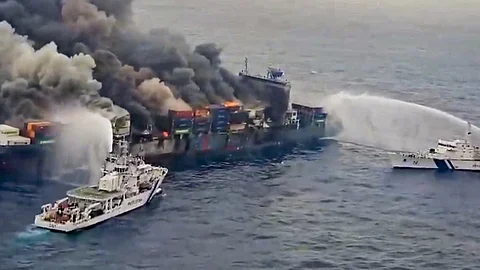 The Indian Coast Guard ships carry out the firefighting operation after a fire broke out on a Singapore-flagged ship following a container explosion off the Kerala coast, Tuesday, June 10, 2025.
