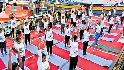 Citizens & representatives of various departments take part in Water Crafts - Floating Yoga campaign on Krishna river in NTR district