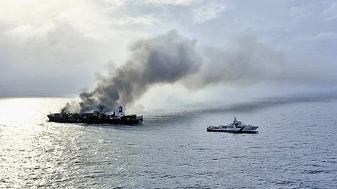 Coast Guard vessel dousing the fire raging in MV Wan Hai 503 on Thursday