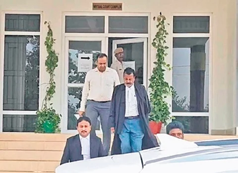 Senior IAS officer Manish Agarwal and his lawyer coming out of court