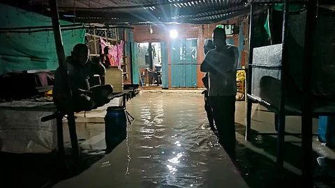 Residents in a flooded house spend sleepless night