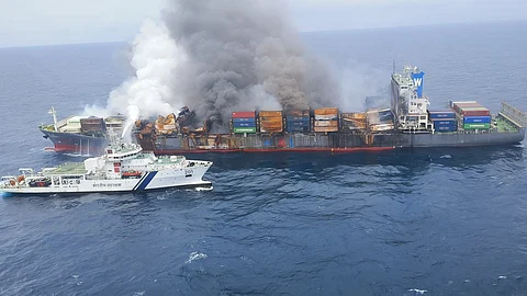 A Coast Guard ship engaged in dousing the fire that broke out on container vessel MV Wan Hai 503, on Wednesday.
