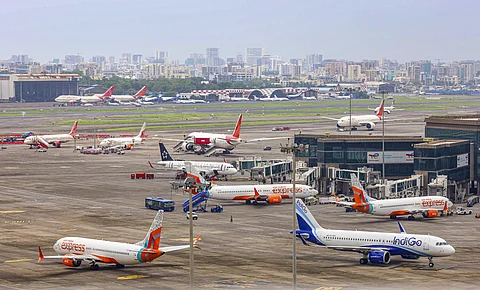 In this image from June 13, 2025, flights are seen parked on the runway at Chhatrapati Shivaji Maharaj International Airport in Mumbai.