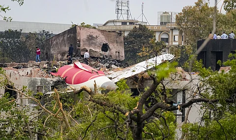 Remains of the crashed Air India plane lie on a building, in Ahmedabad, Friday, June 13, 2025. A London-bound Air India plane carrying 242 passengers crashed moments after taking off from the Ahmedabad airport on Thursday.
