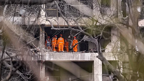 NDRF personnel at the site of the Air India plane crash, in Ahmedabad, Friday, June 13, 2025. A London-bound Air India plane carrying 242 passengers crashed moments after taking off from the Ahmedabad airport on Thursday.