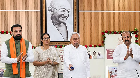 Bihar Chief Minister Nitish Kumar transfers financial assistance amount through DBT to the bank accounts of beneficiaries under Social Security Pension Scheme and Mukhyamantri Kanya Utthan Yojana, in Patna, Friday, June 13, 2005.
