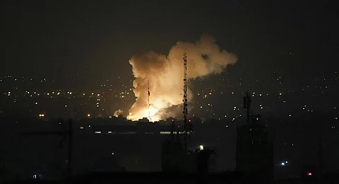 Smoke rises up after an explosion in Tehran, Iran, Friday, June 13, 2025.