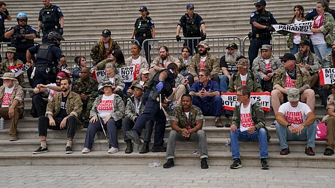 Demonstrators breach a U.S. Capitol barrier while protesting the upcoming parade for the Army’s 250th anniversary, which falls on President Donald Trump's birthday, on June 13, 2025 in Washington.