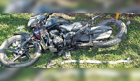 The bike of Ramesh (inset) that was crushed after the girders collapsed on Thursday
