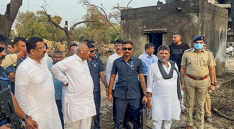 Congress President and Leader of Opposition in the Rajya Sabha Mallikarjun Kharge, Karnataka Deputy Chief Minister DK Shivakumar, party leader Pawan Khera and others during a visit to site of the Air India plane crash, in Ahmedabad.