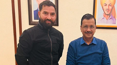 AAP MLA Mehraj Malik with Arvind Kejriwal.