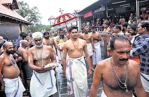 Thantri Kandararu Brahmadathan leading the procession carrying brahmakalasam as part of kalabhabhishekam ritual at Sabarimala temple on Sunday
